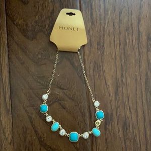 Gold necklace with blue gemstones